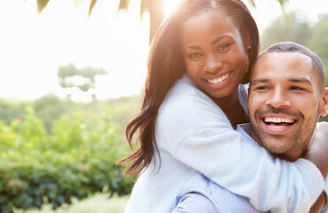 Portrait Of Loving African American Couple In Countryside