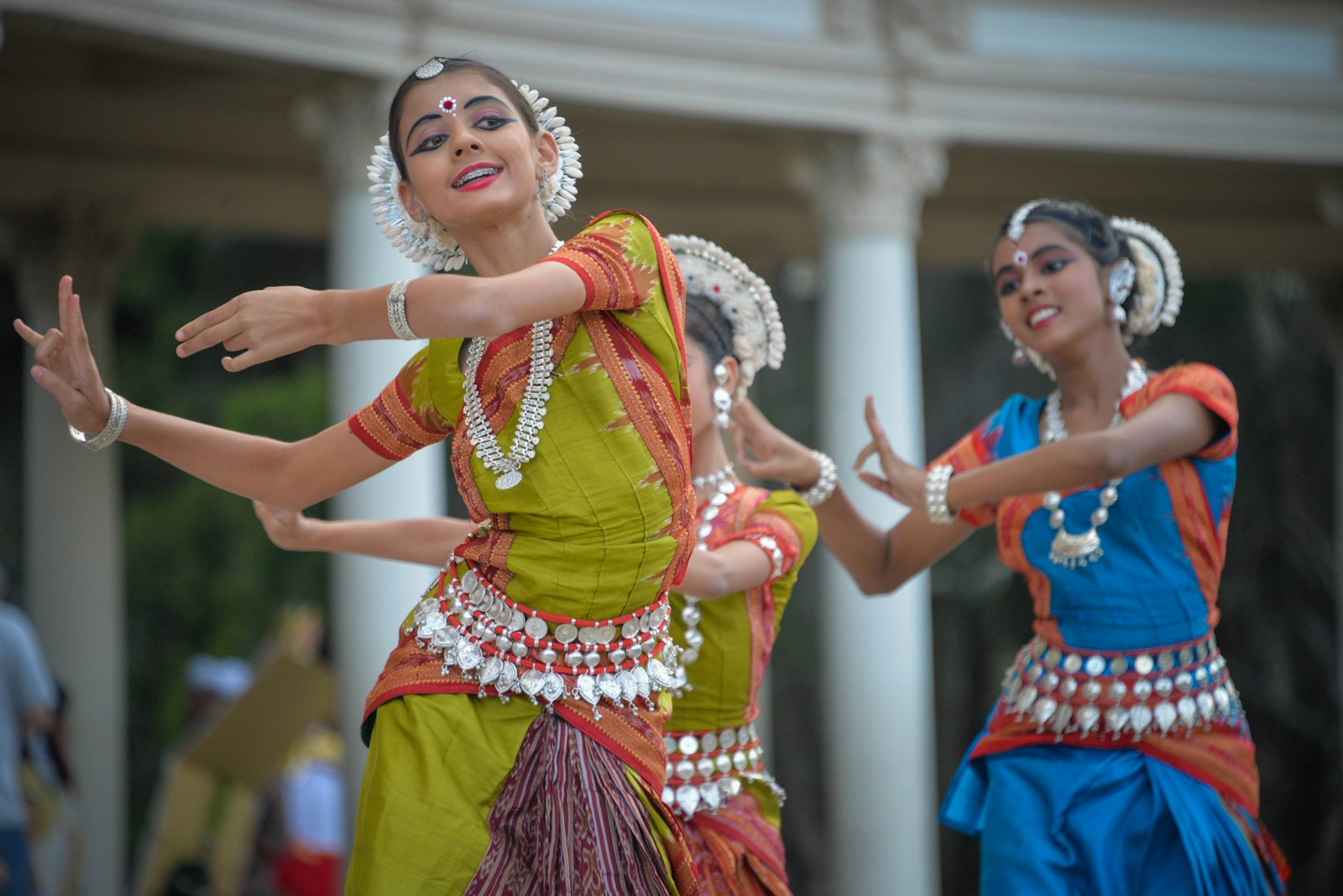 three woman performing traditional dance